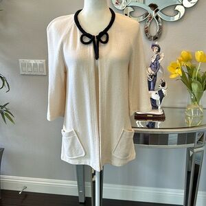St John Collection cream jacket with black trimmings. Swing cape design size 4